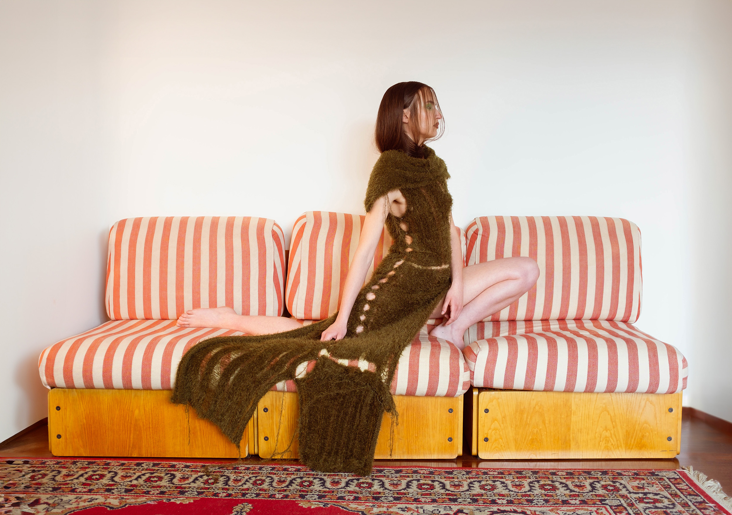 a woman sitting on a couch