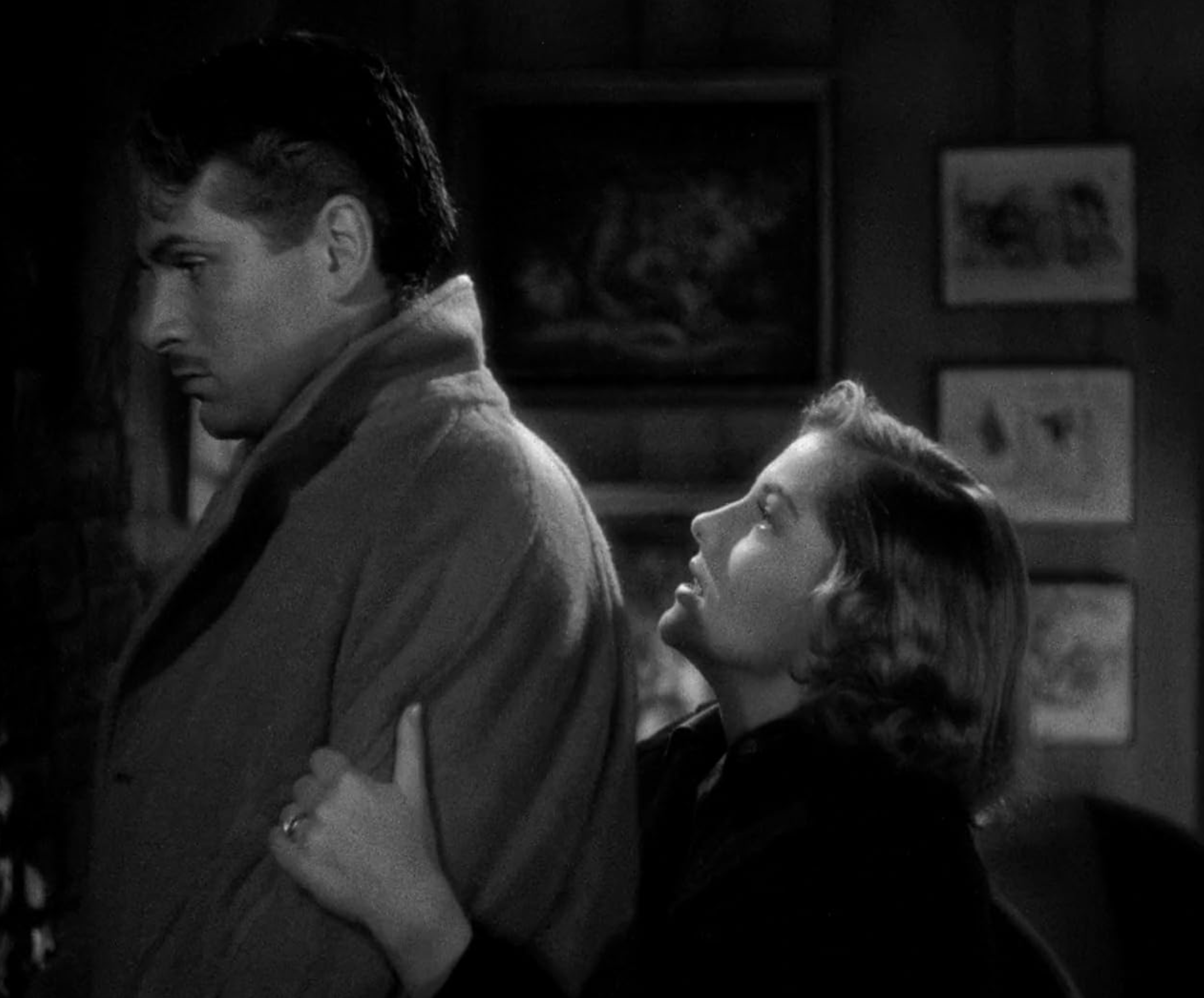 a man and woman standing back to back